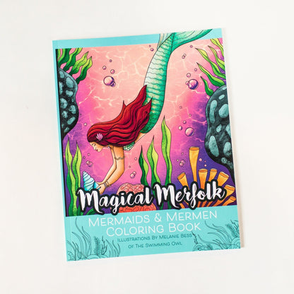 Coloring book titled 'Magical Merfolk' with mermaid illustration on a white background